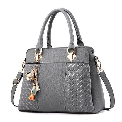 Elegant Gray Handbag with Decorative Tassels